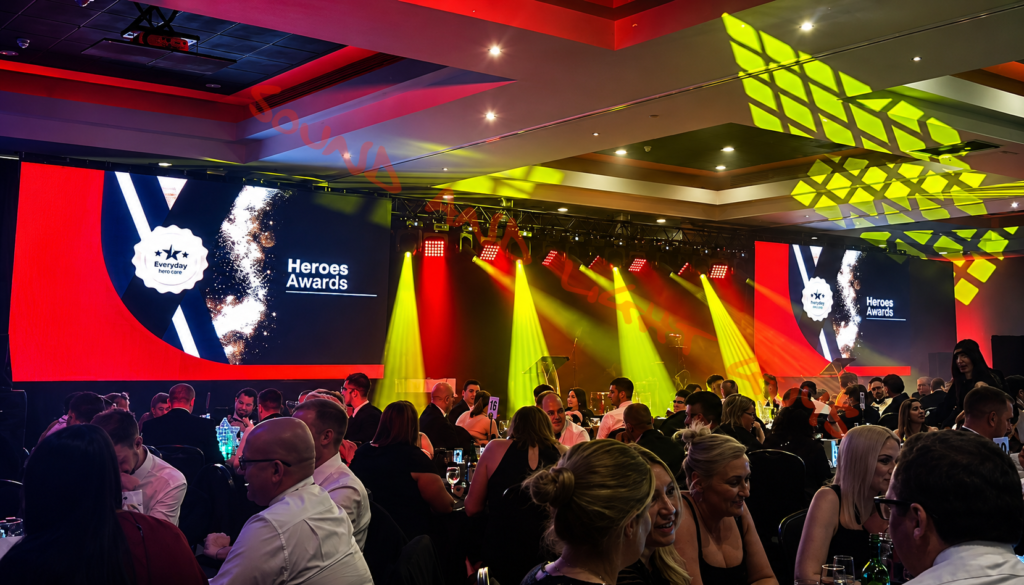 Professional AV equipment rental setup featuring LED screens, stage lighting, speakers, and audio visual production equipment at a live events.