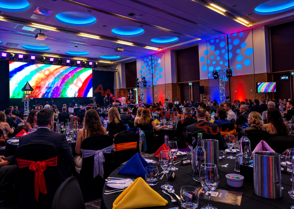 Professional AV hire setup in London featuring LED screens, stage lighting, sound systems, and conference event production equipment.